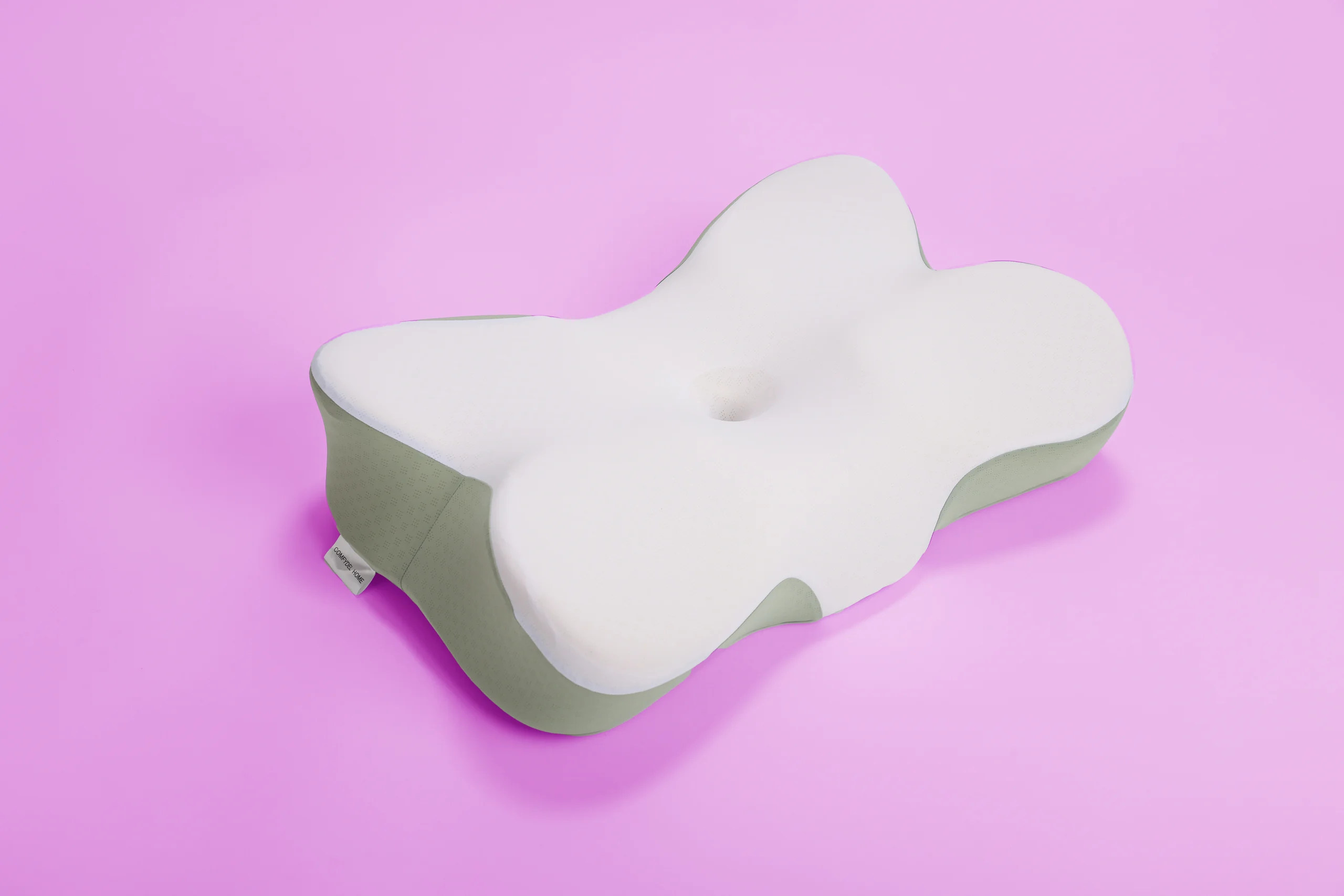 The butterfly-shaped pillow on the brand’s lilac.